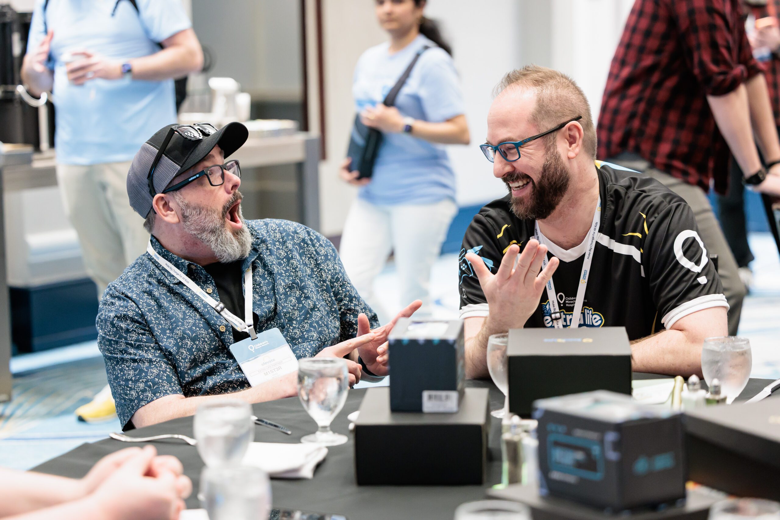 Two Extra Life Participants laughing at an event.