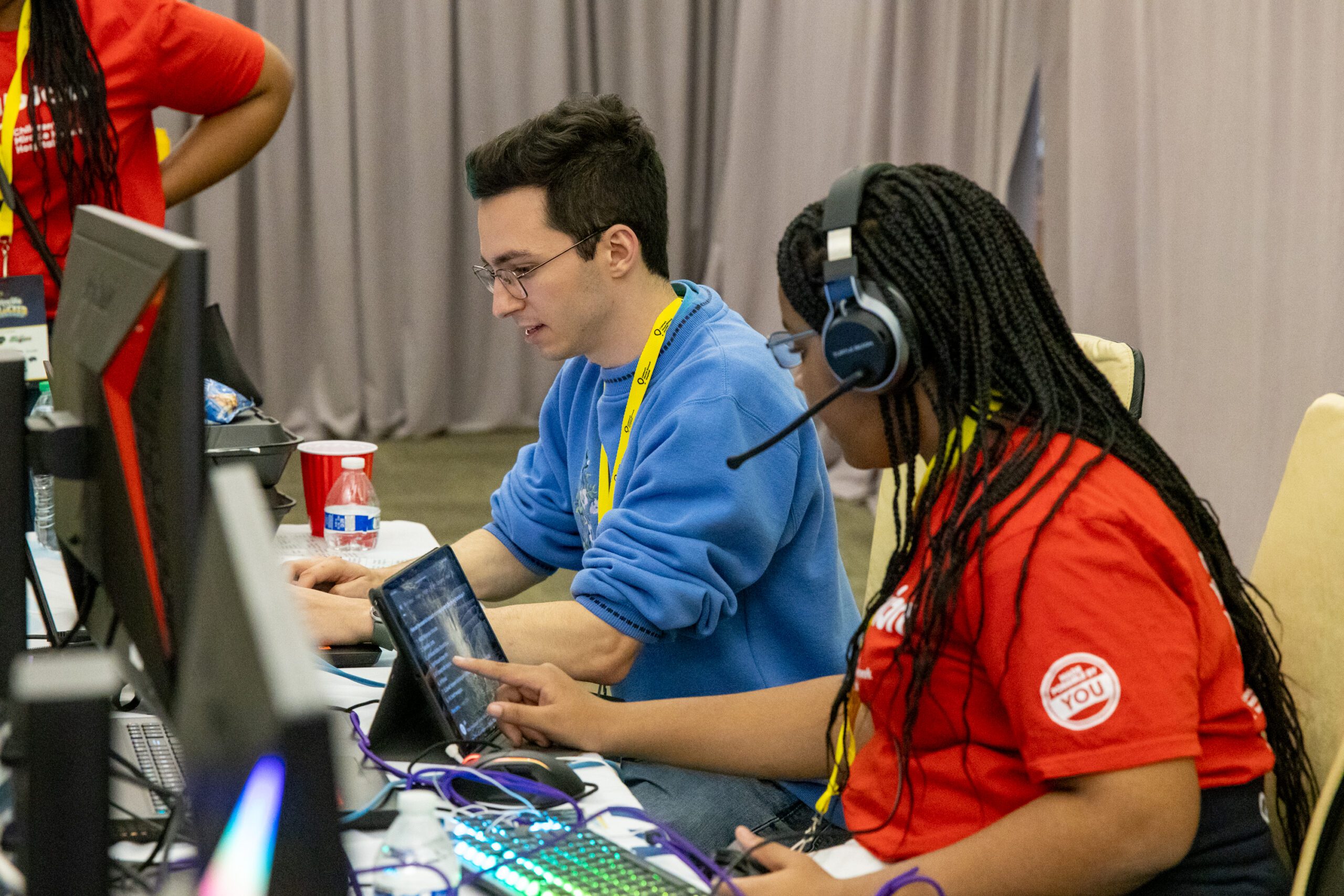 Woman playing video games with headset on.