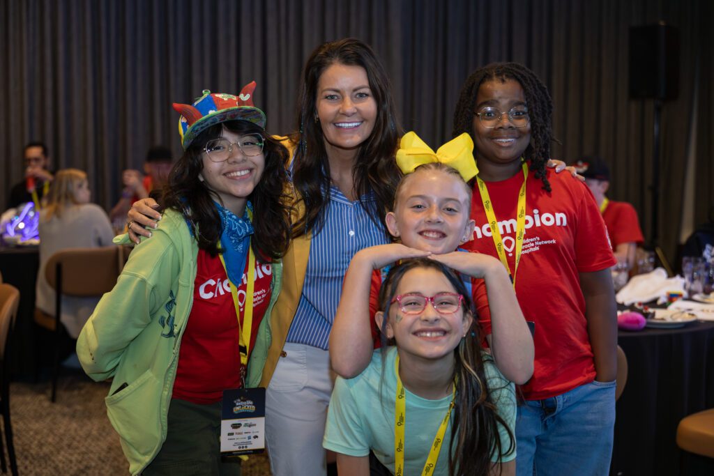 CEO Aimee J. Daily with champions.